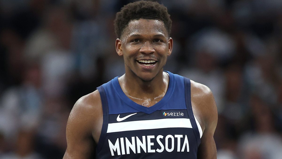 Anthony Edwards smiles in a Minnesota Timberwolves jersey.